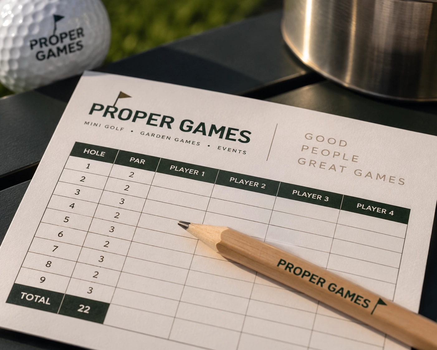Proper Games branded mini-golf scorecard and pencil